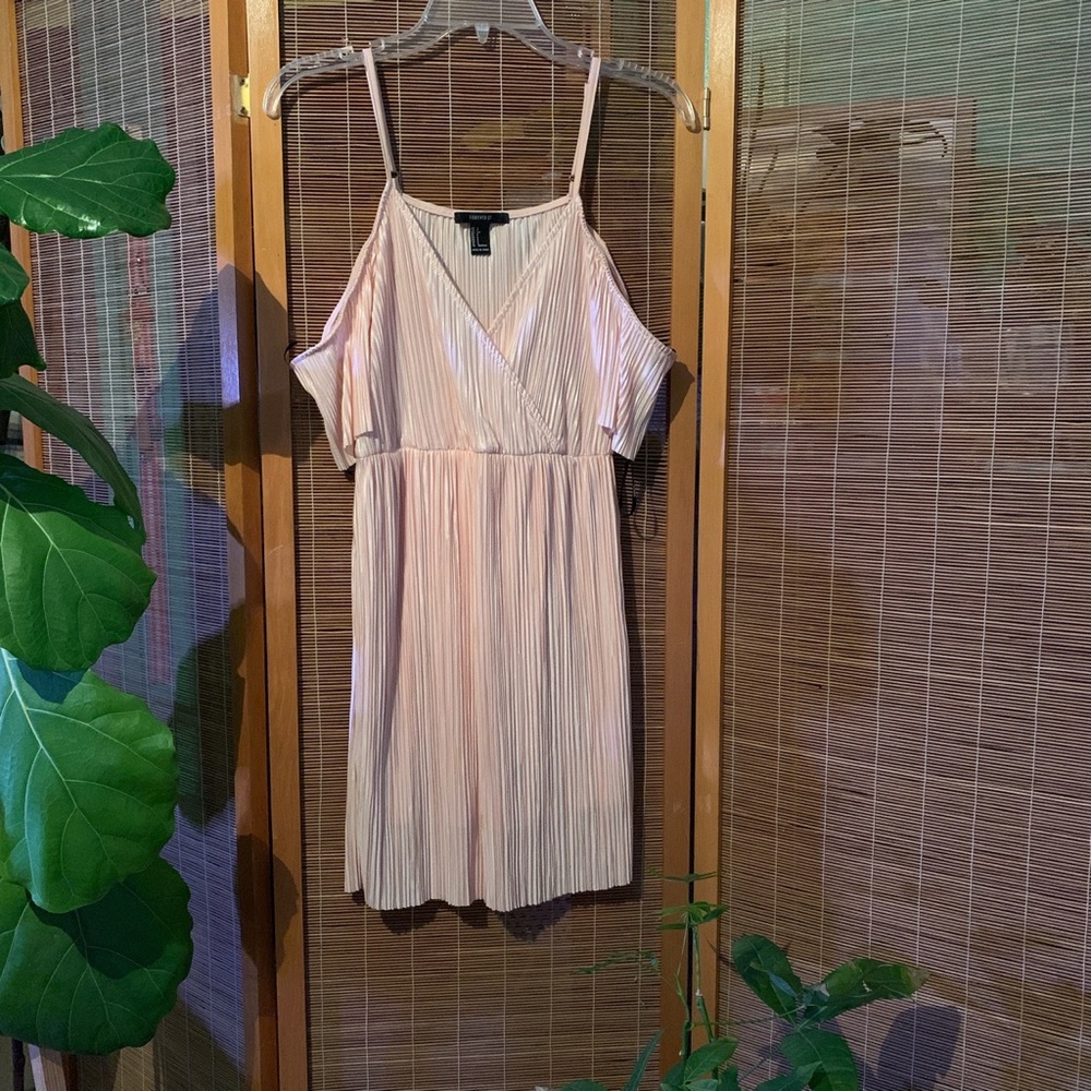 Small soft pink pleated mini dress with straps and off the shoulder sleeves.